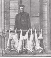 Hunter, Charles Kester with rabbits