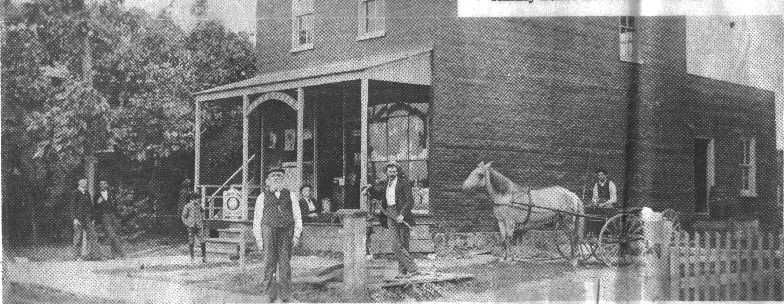 John Goddard standing in front of the general store and post office in Chancy