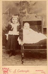 Child and Baby on Chair