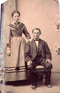 Tintype, unknown woman standing, man siting