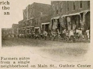 Farmers autos from a single neighborhood on Main Street, Guthrie Center, Iowa