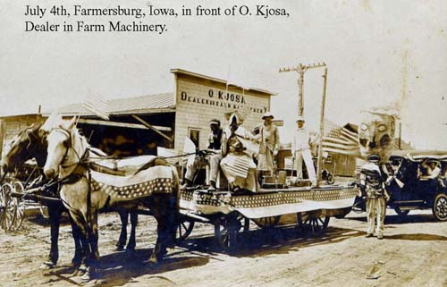 4th of July parade in front of the O. Kjosa Farm Machinery dealership, Farmersburg