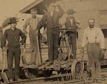 Close-up of men at the Garber train depot - undated