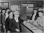 Men getting paychecks, possibly at coal mine, Granger, Iowa