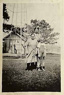 Two women, boy, windmill